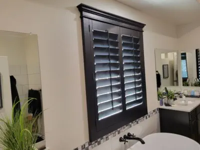 Shutters in a bathroom dark color